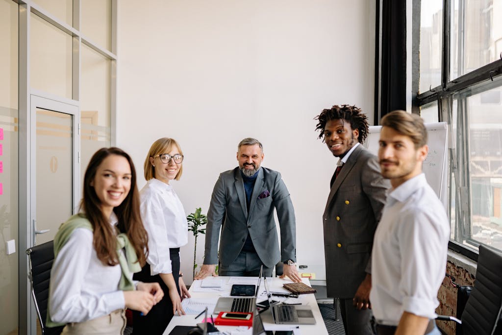 Group of professionals collaborating in a contemporary office setting.